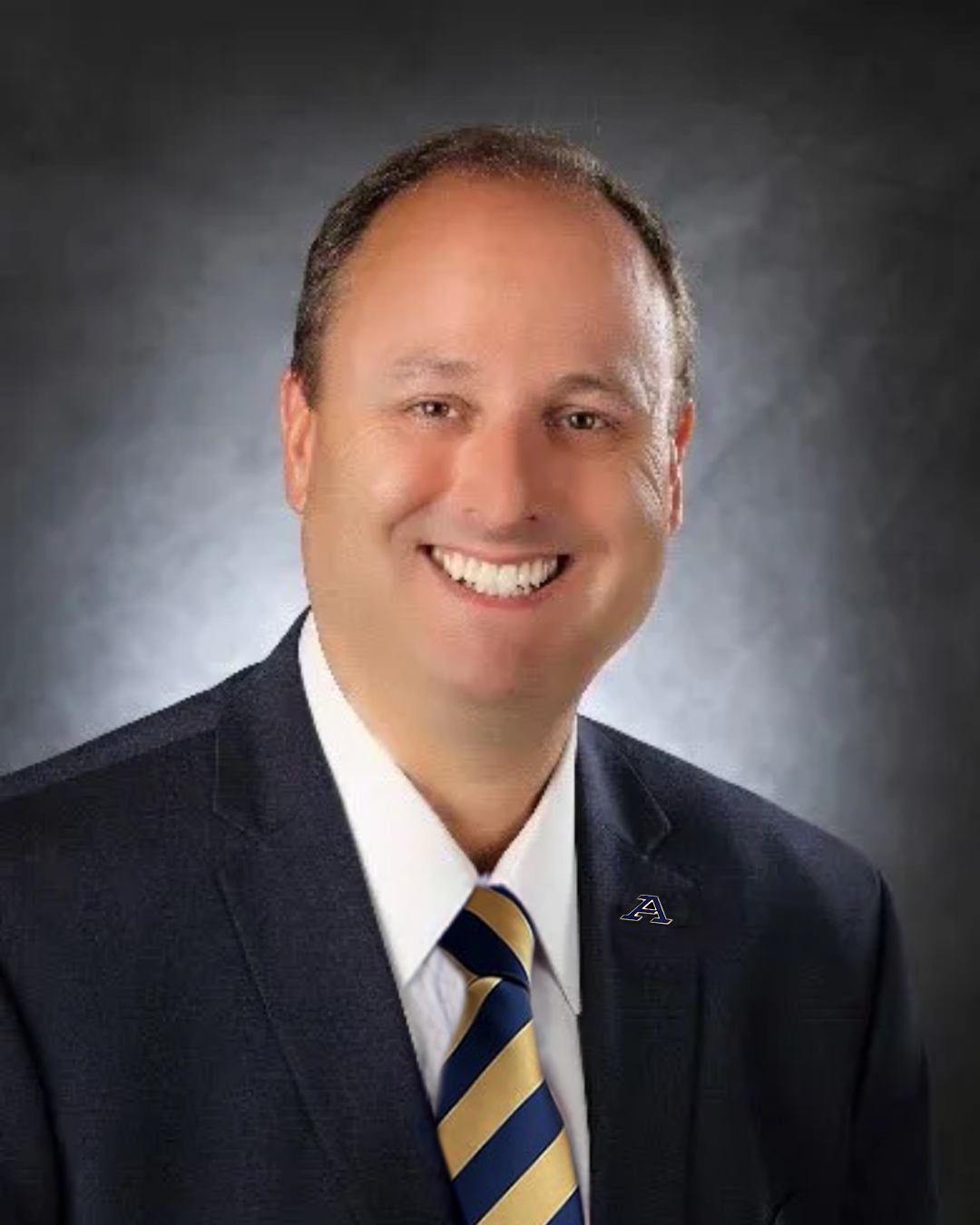 Dr. Roberts - blue & gold tie & A pin.jpg